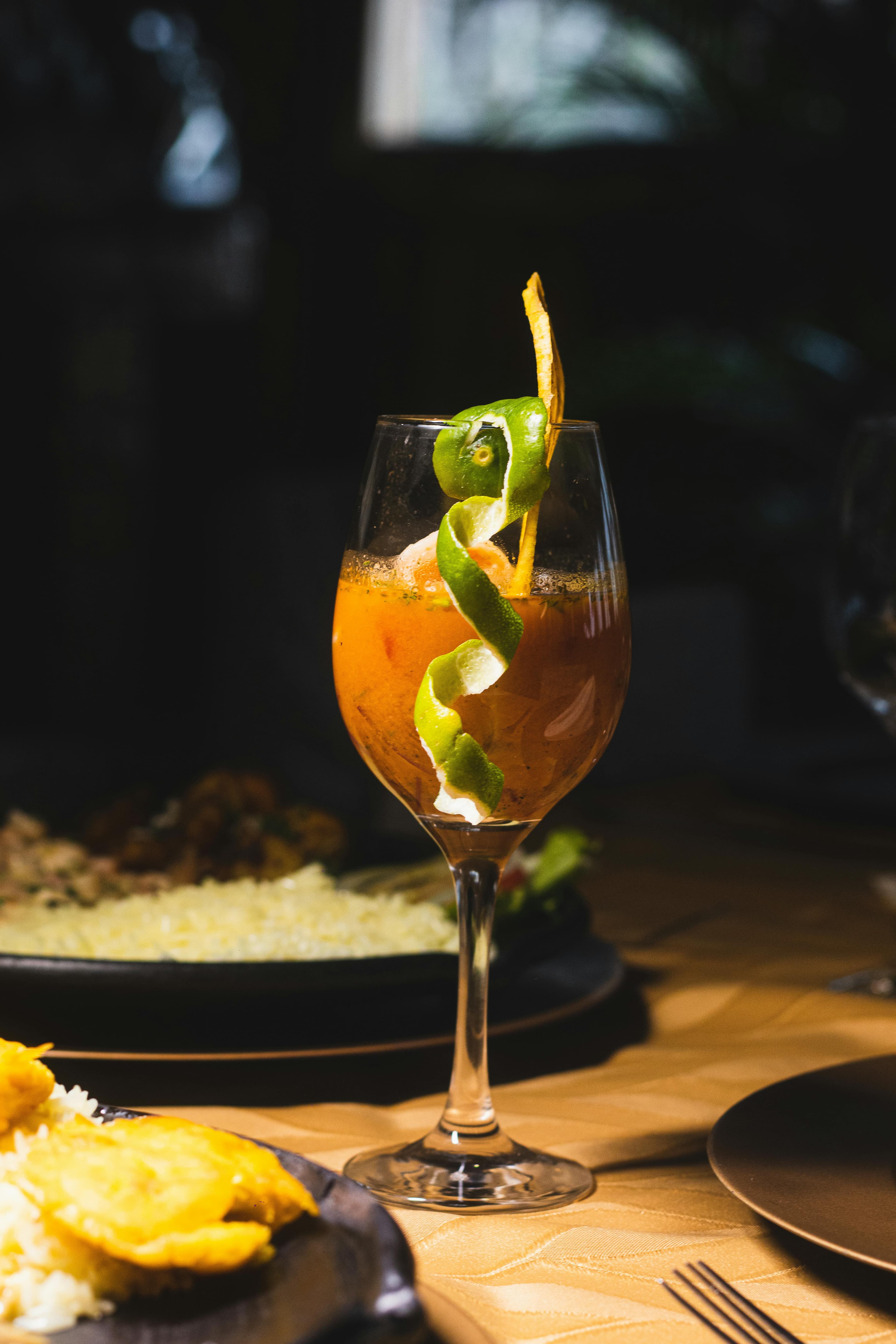 Craft Cocktails - refreshing cocktail with fruit garnish in elegant setting